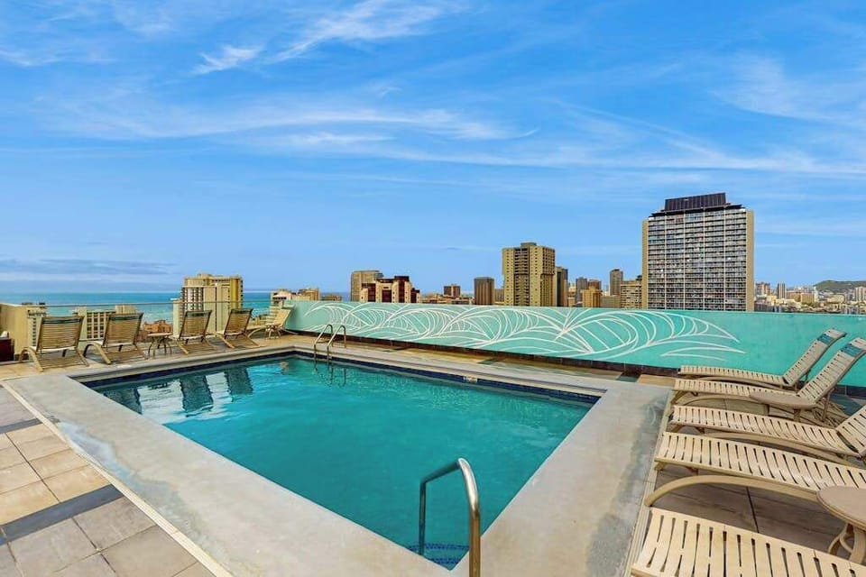 Rooftop swimming pool overlooking Waikiki skyline