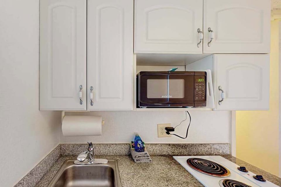 Compact kitchenette with convenient cooking essentials