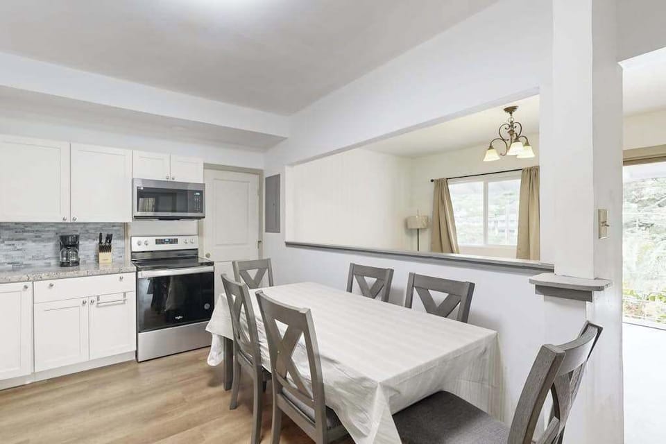 Enjoy shared meals and easy conversation in a welcoming dining area that flows seamlessly into the kitchen.