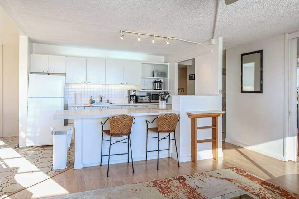 Enjoy extra space for meal preparation, dining, and gathering around the stylish kitchen island.