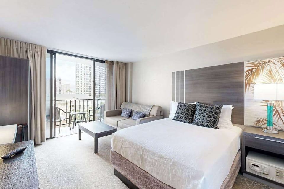 Relax and unwind in a welcoming space featuring a comfortable queen bed and an additional full-size sofa bed.