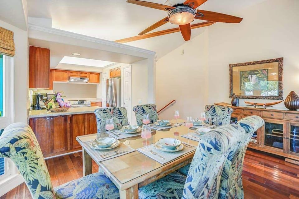 Dining room with seating for six, open to the living room and kitchen.