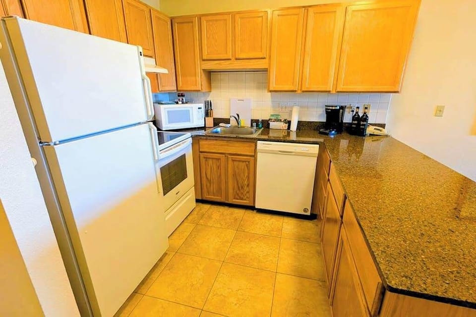 Spacious kitchen with ample counter space and modern appliances