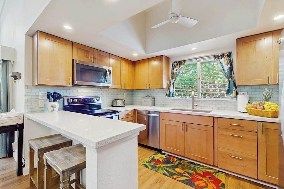 Functional kitchen includes spacious appliances and convenient meal preparation space.