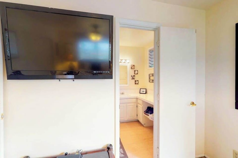 Master bedroom with flat screen tv.