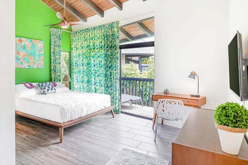 Bright king bedroom with vibrant tropical accents