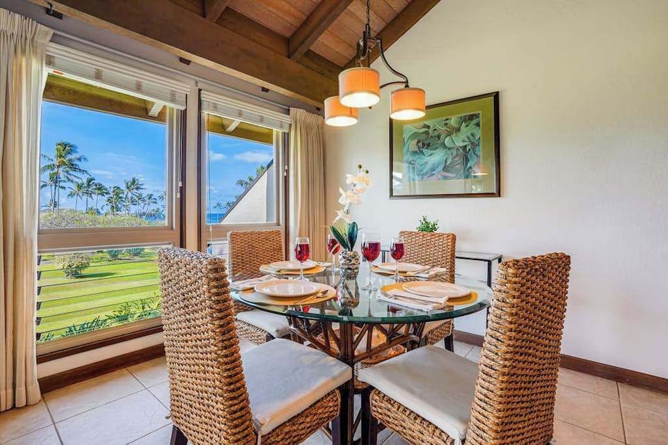 Scenic Dining Nook with Large Windows Overlooking Lush Greenery