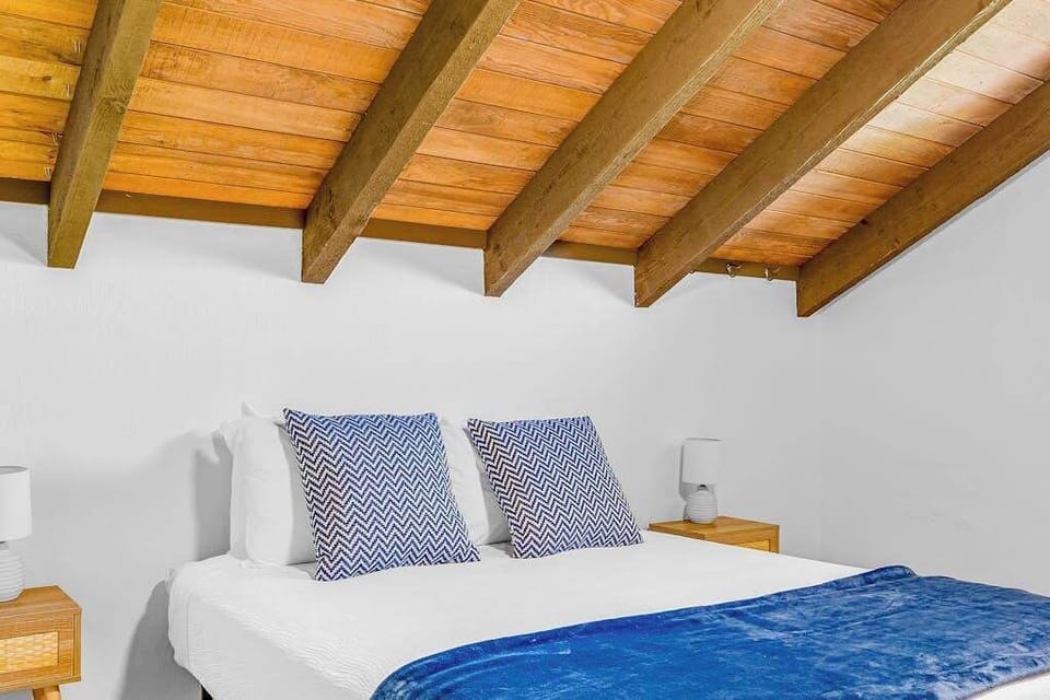 Charming Loft Bedroom With Vaulted Ceilings