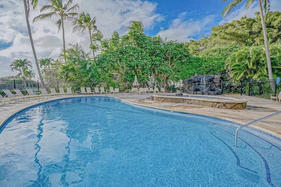 Sparkling Resort Pool Surrounded By Palms