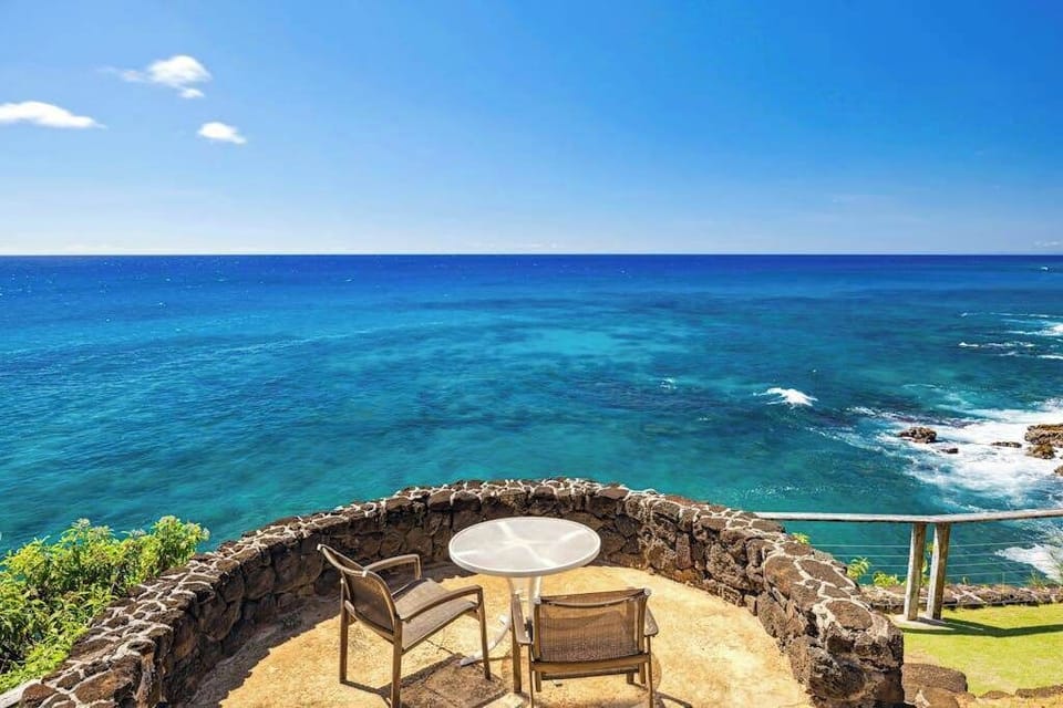 From your oceanfront perch on a lava-rock cliff, a dazzling ombre of blues tantalizes the eyes and the smell of saltwater tickles your nose. Let the ocean breezes warm you as you lounge on multiple lanais, listening to the waves crash below. 