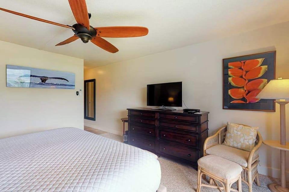 Wake up refreshed with balcony views, TV, and cooling ceiling fan
