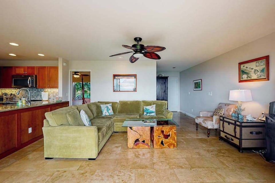 Bright living room showcases ocean views, woven accents, and seating