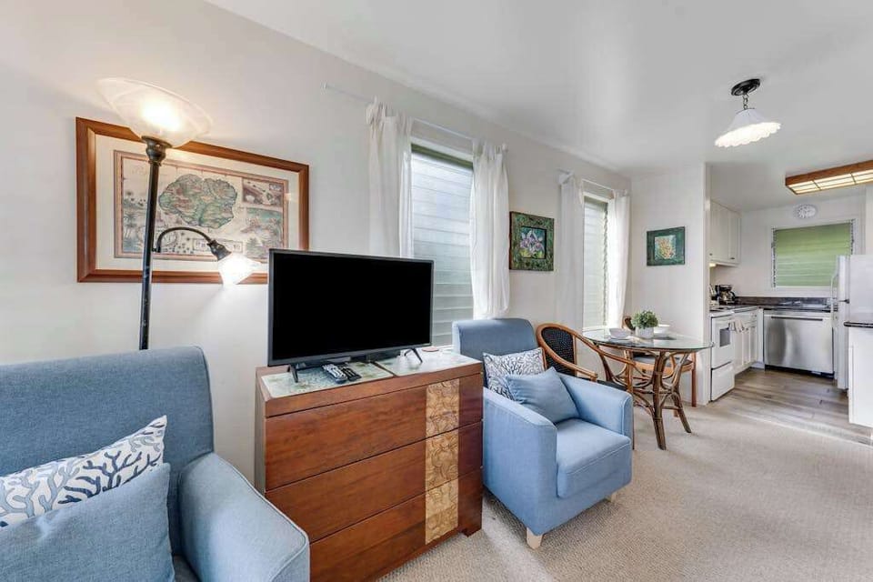 Comfortable living room with Smart TV and cozy seating.