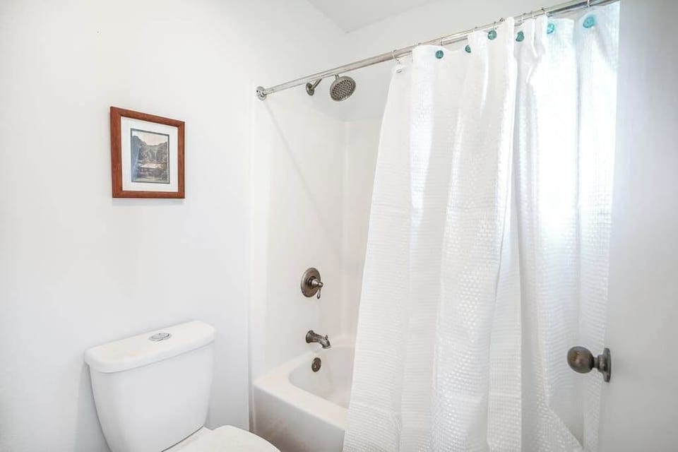 Spotless Bathroom With Shower And Tub