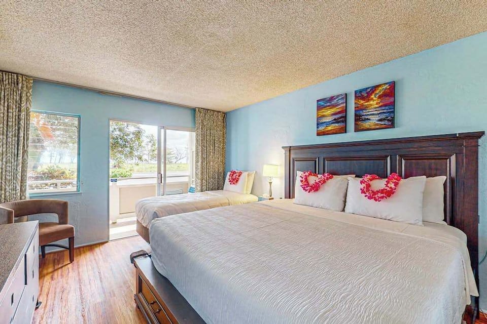 Master bedroom with king bed, single bed and a fold up crib for your use.