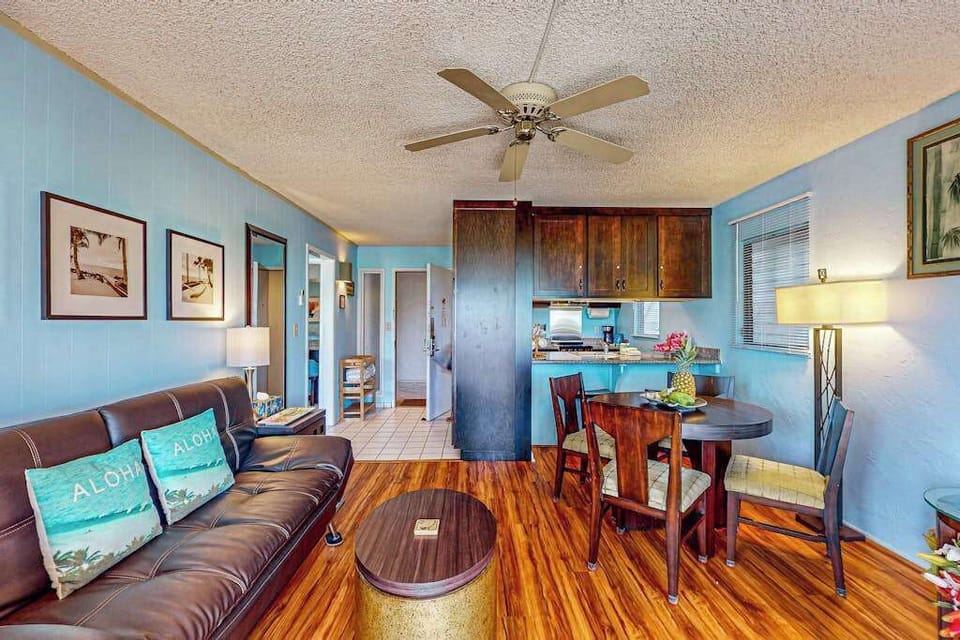 Lovely home decor, spacious living room with a flat screen tv and sleeper sofa.