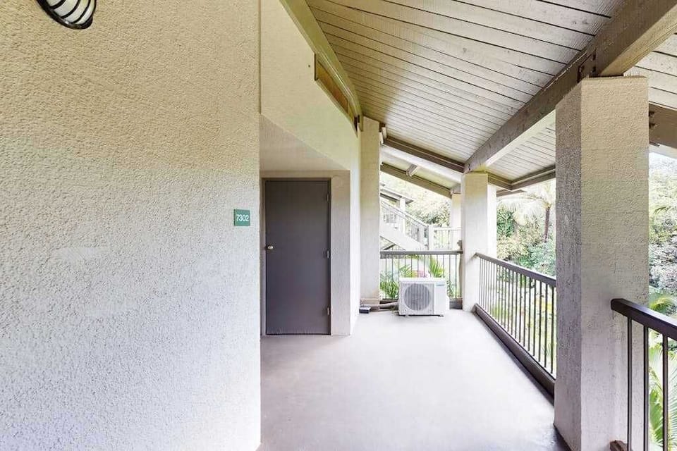 Covered hallway offers easy access throughout the peaceful tropical property