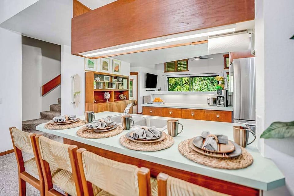 Four barstools for extra seating at the kitchen counter. 