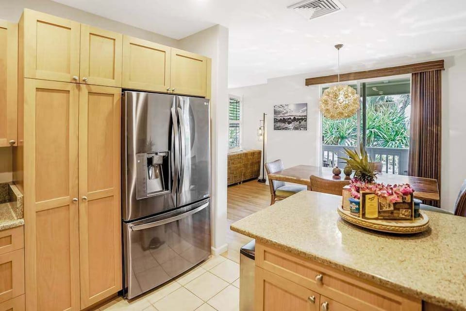 Fully-equipped kitchen, which is complete with all the modern appliances to make cooking a breeze, including a French-door fridge, stove, oven, dishwasher, microwave, and coffee maker.