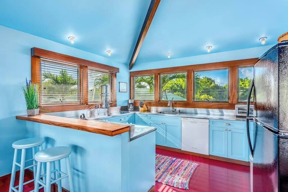 Spacious dining area within the kitchen offers coordinated seating beneath bright natural light