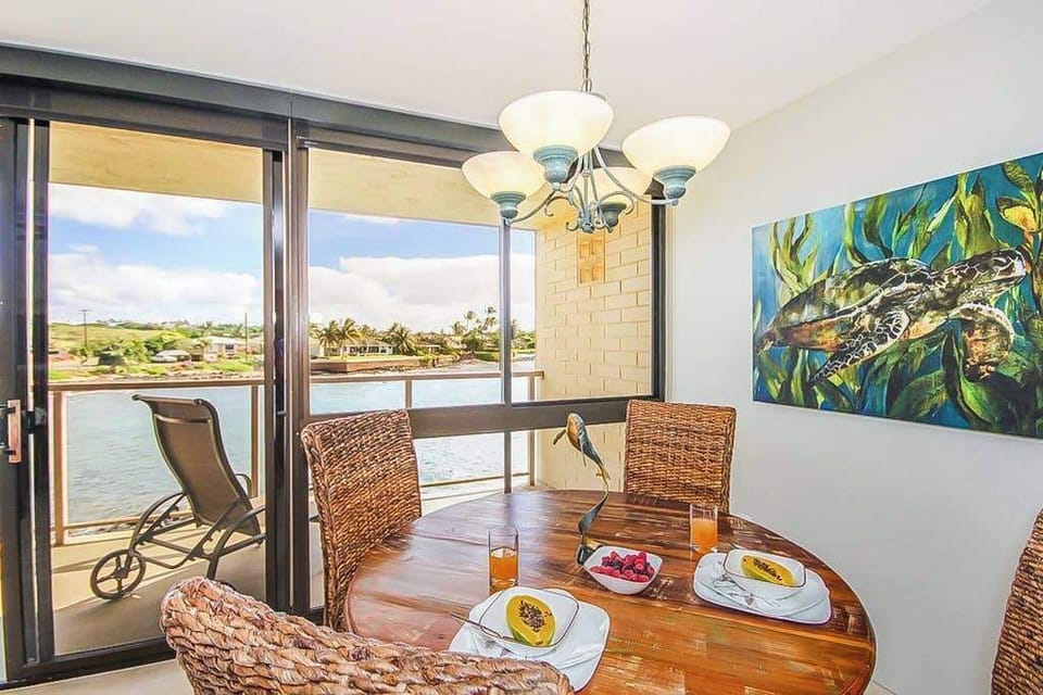 Dining room with table for four for a perfect dinner in with a view of the Pacific Ocean.