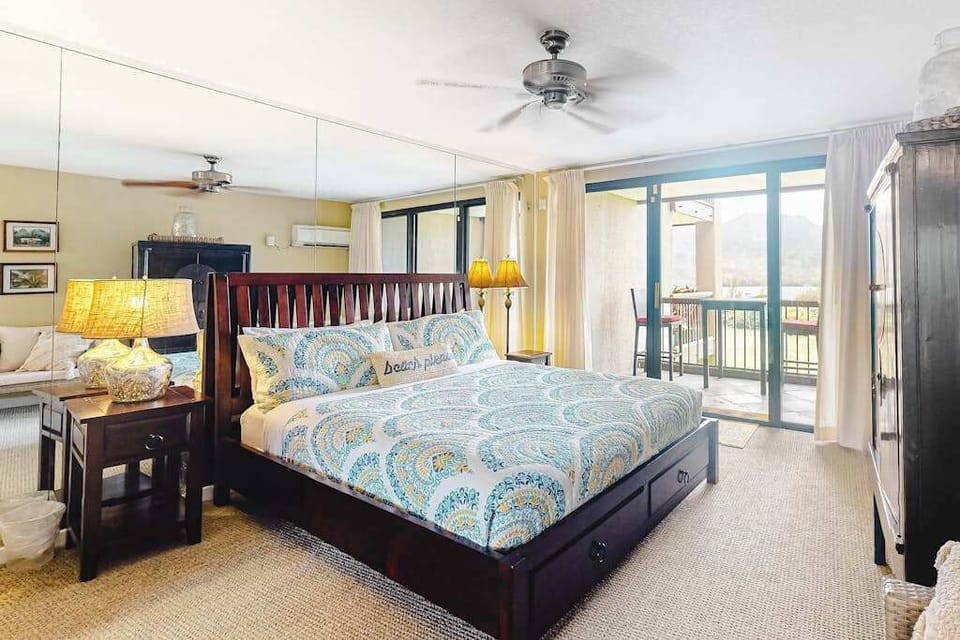 Rest comfortably in this welcoming bedroom with refreshing outdoor views