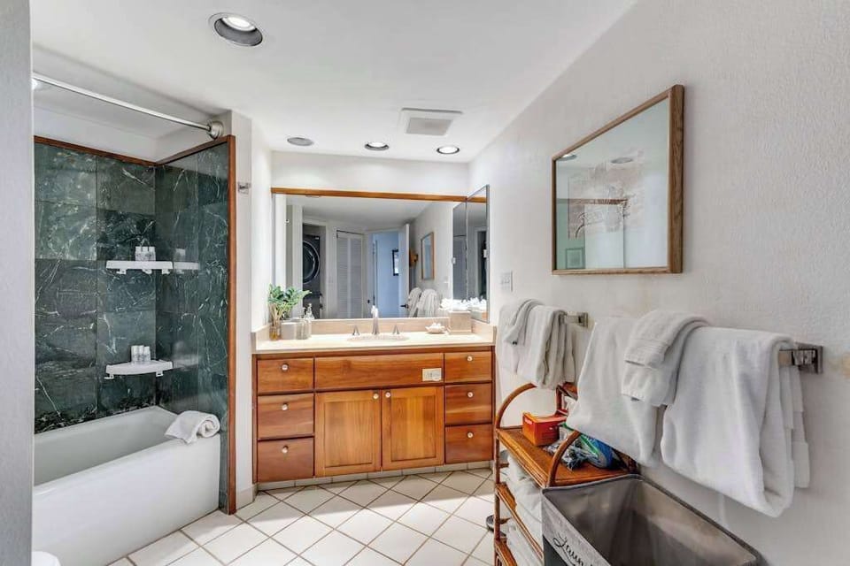 Ensuite bathroom with rain shower, designed to relax after a day at the beach