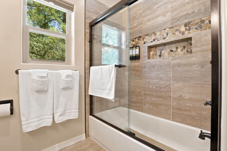 Full bathroom with a tub/shower combination. Complimentary amenities.