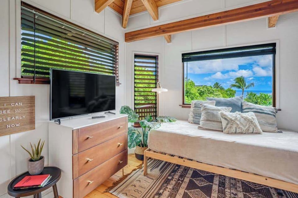 Primary suite with comfortable Kind bed and a TV