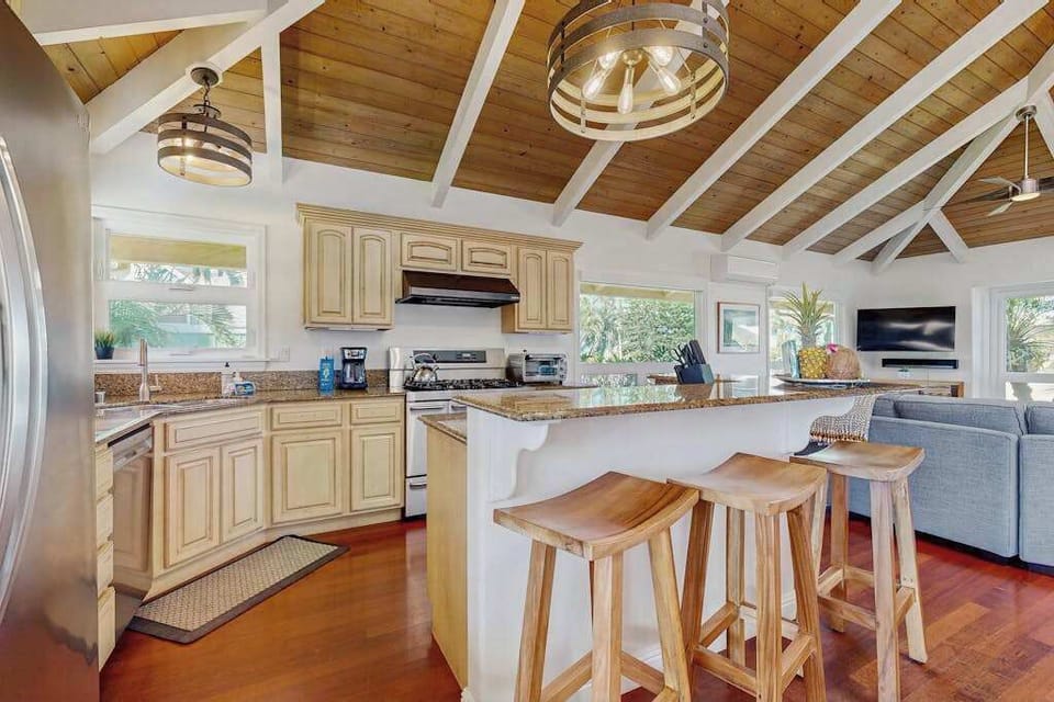 Bright, open floor plan with abundant natural light and extra seating—perfect for your sous chef or gathering with family and friends.