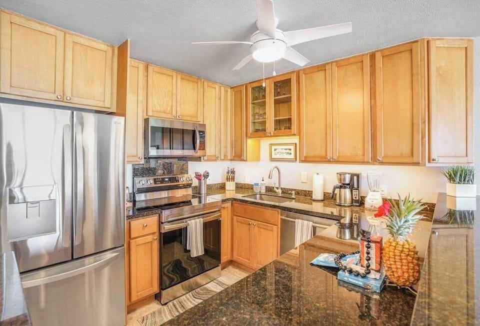 Fully Equipped Kitchen With Wood Cabinetry