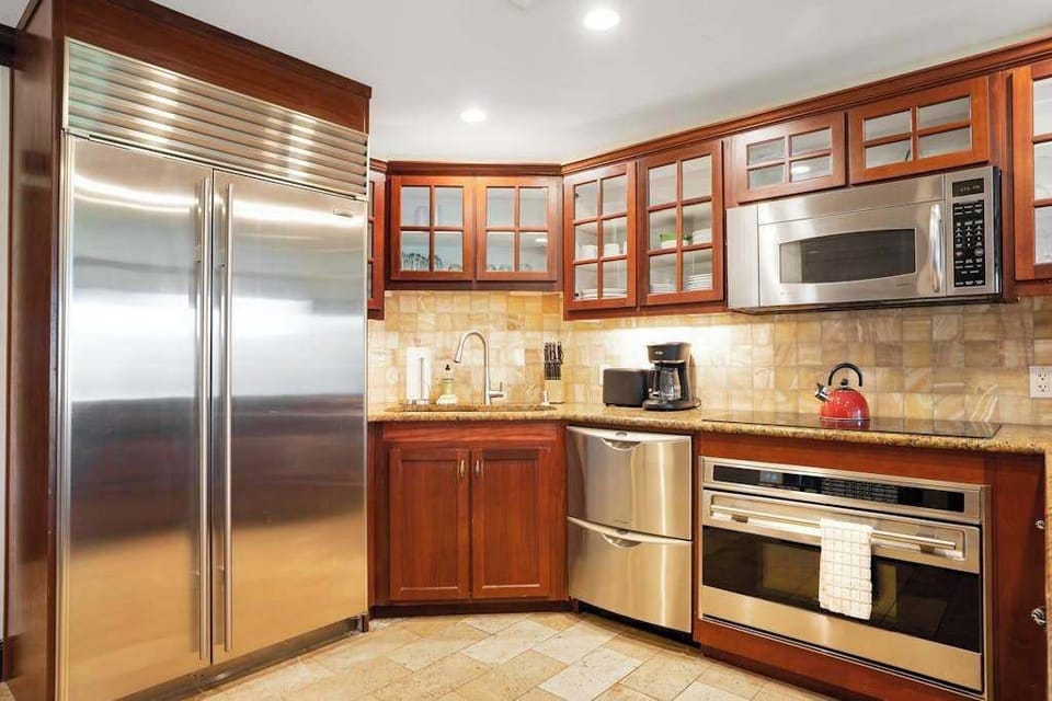 Prepare and enjoy delicious meals in the modern kitchen featuring sleek stainless steel appliances.