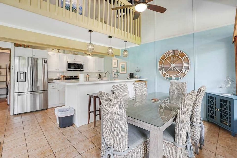 Dining area with seating for six, plus two additional counter stools at the kitchen island.