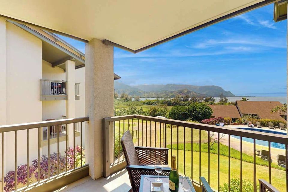 Covered balcony provides seating, mountain views, and refreshing island breezes