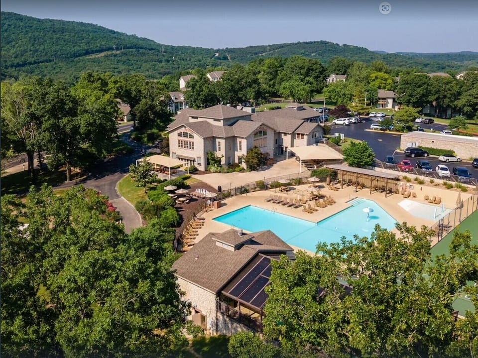 Enjoy resort-style amenities at Pointe Royale Golf Village including 3 pools, hot tub, fitness center, tennis & pickleball courts, hiking trails, playgrounds, PGA golf, The Grille, and access to Lake Taneycomo!