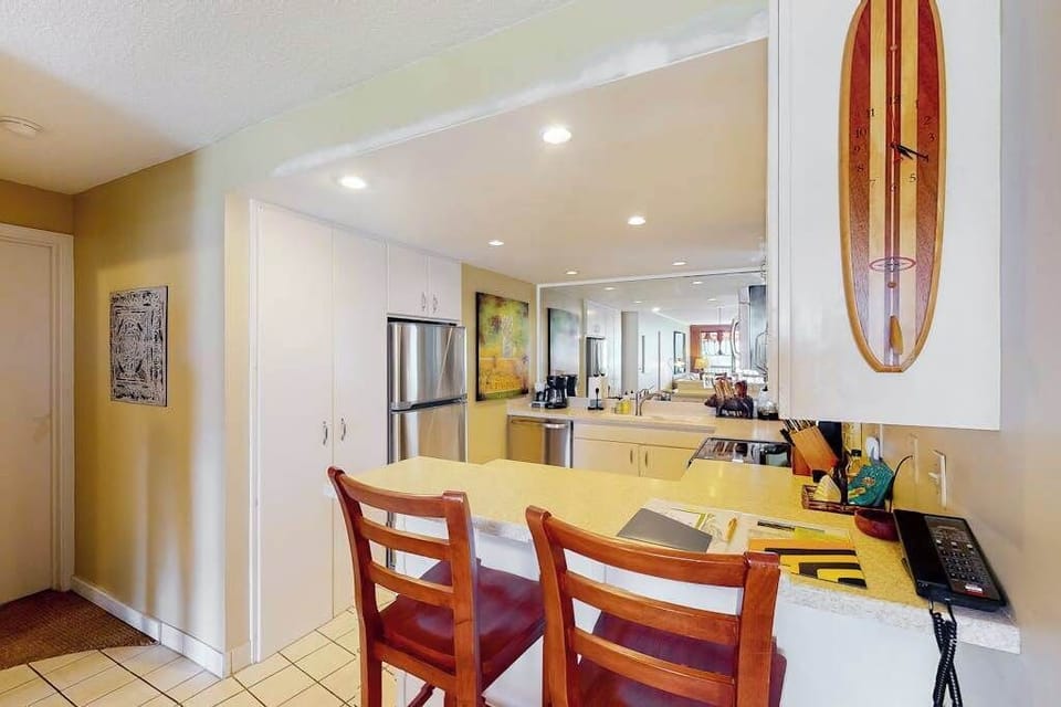 Modern kitchen offers stainless appliances, generous counters, and convenient storage