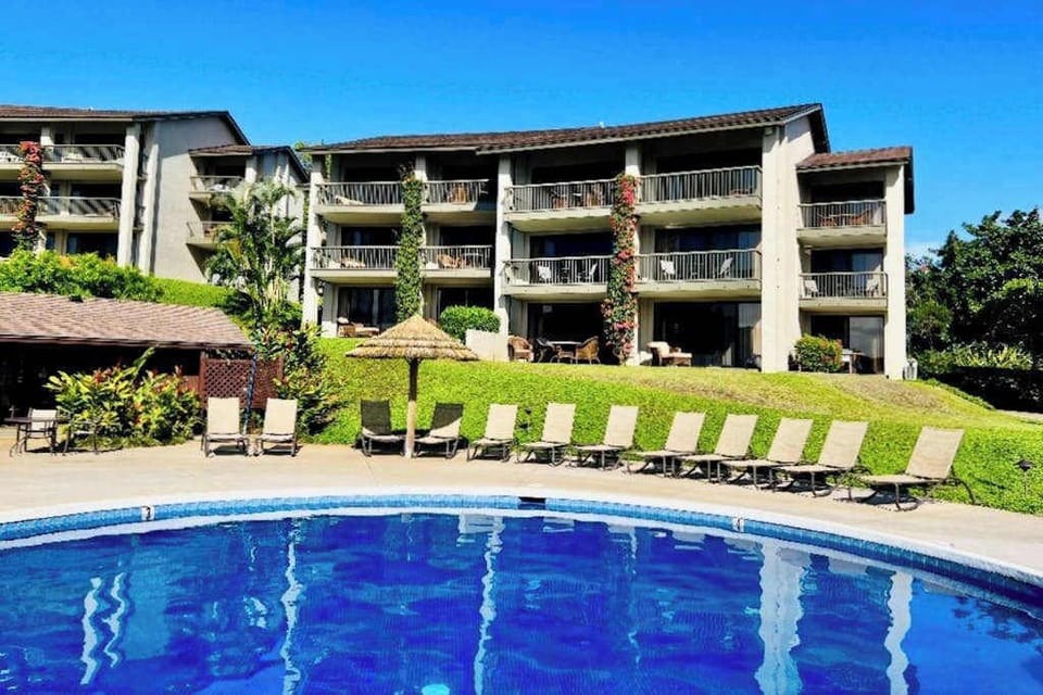 Refresh beside the sparkling pool surrounded by beautiful resort scenery