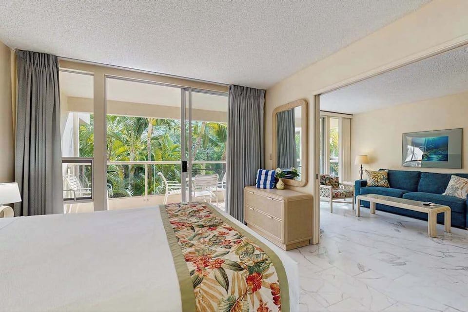 Peaceful bedroom with tropical views and natural light