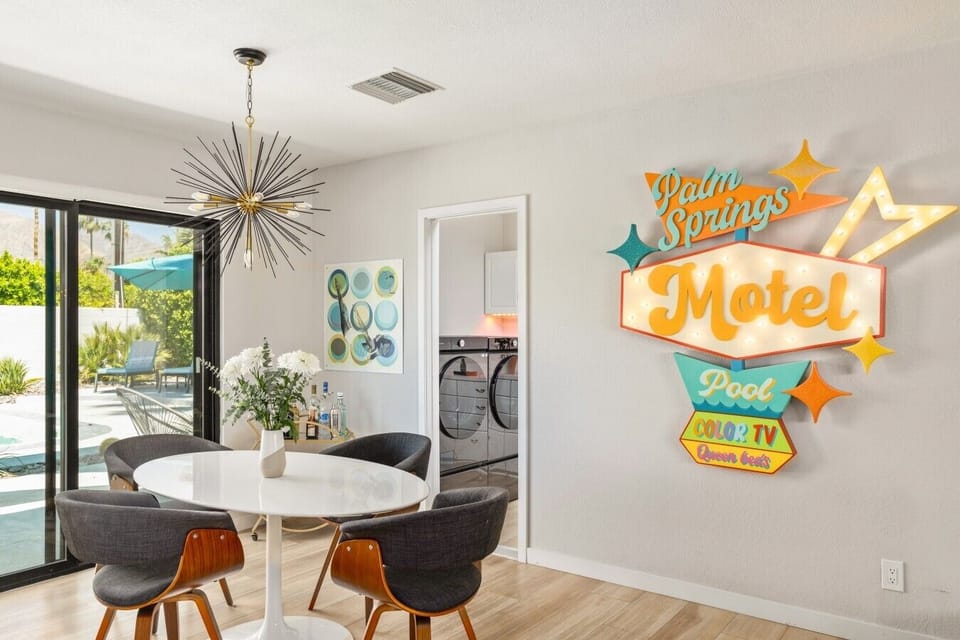 Bright dining spot with direct sightlines to the pool and patio.