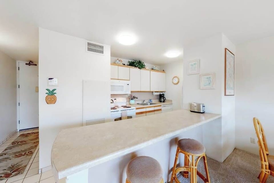 Open kitchen with convenient breakfast bar seating