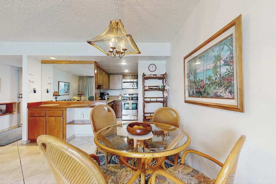 Share breakfast or dinner around the cozy dining table just steps from the fully equipped kitchen.