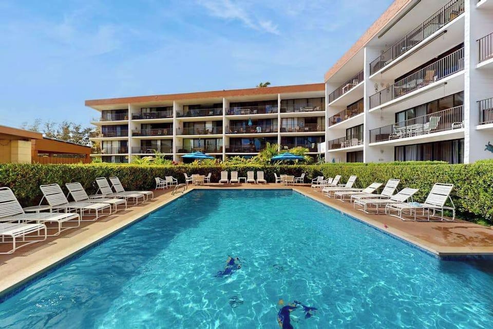 Sparkling Resort Pool Deck & Sun Loungers