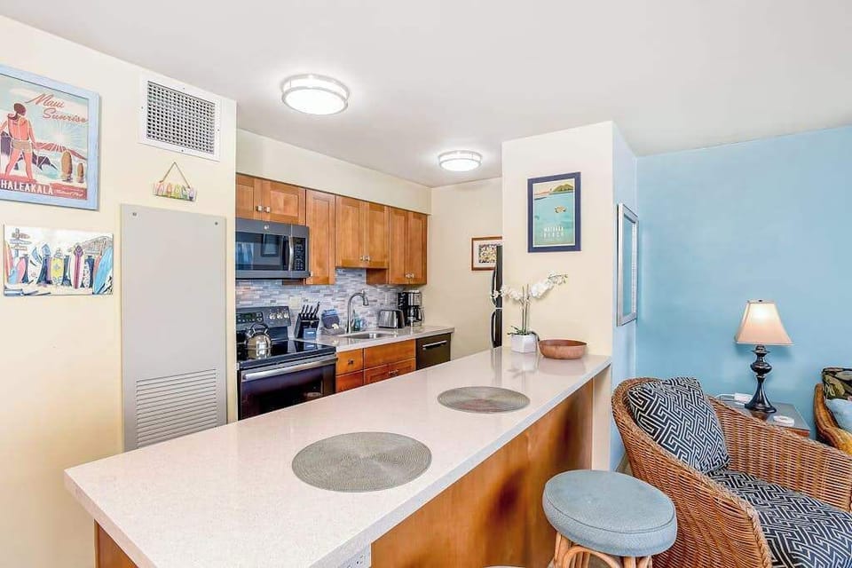 Barstools at the kitchen counter for extra seating.