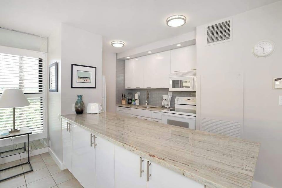 Modern new kitchen with lots of natural light and views in from the outside lanai.