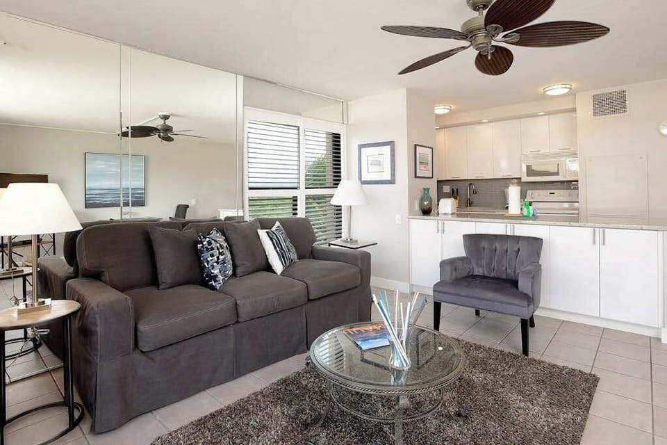 Newly remodeled condo living room with comfortable furniture and a sofa bed for extra guests.