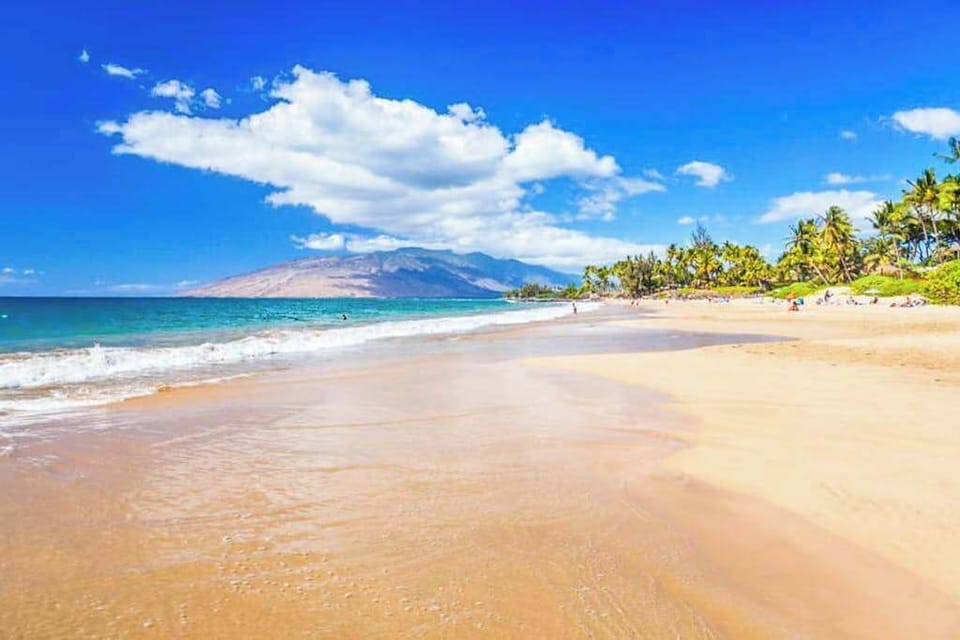Golden sand beach and turquoise waters just steps from the property
