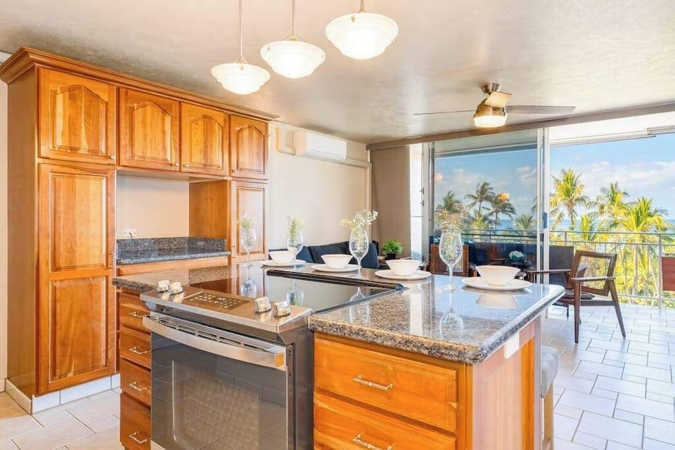 Fully equipped kitchen featuring modern appliances and ocean views