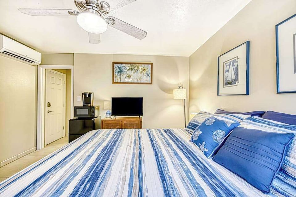 Guest room with king bed and a flat screen tv for your entertainment.