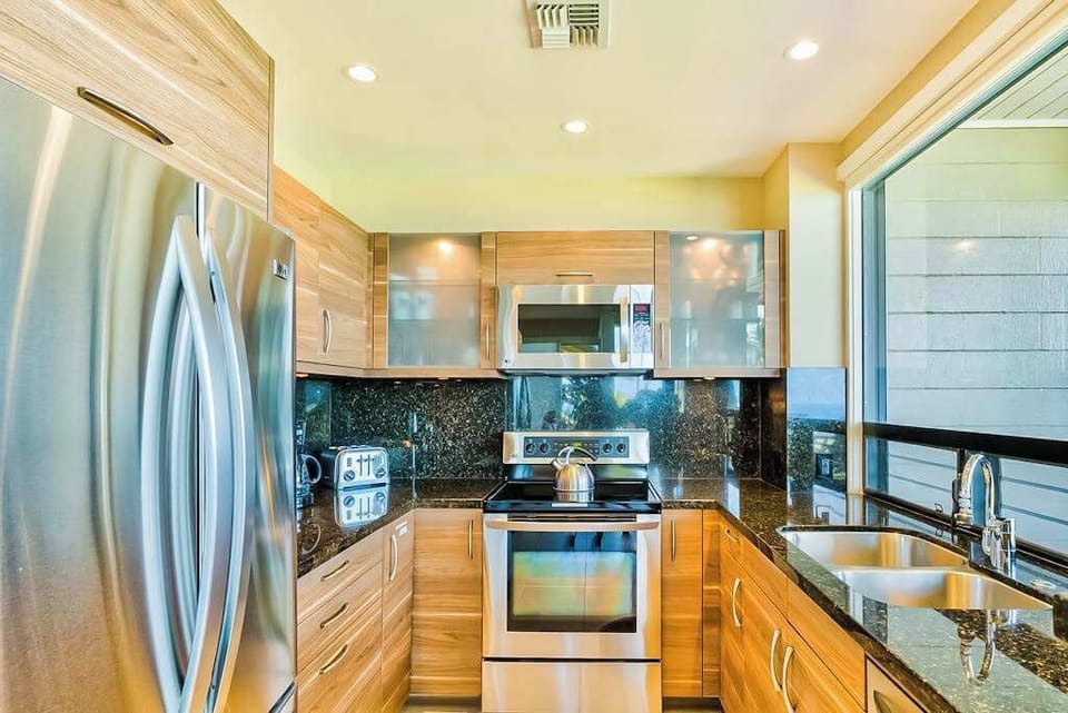 Fabulously remodeled new kitchen with stainless steel appliances and granite countertops.