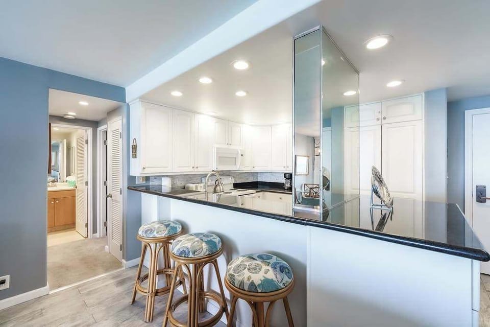 Barstools at kitchen counter for extra seating or for your sous chef.